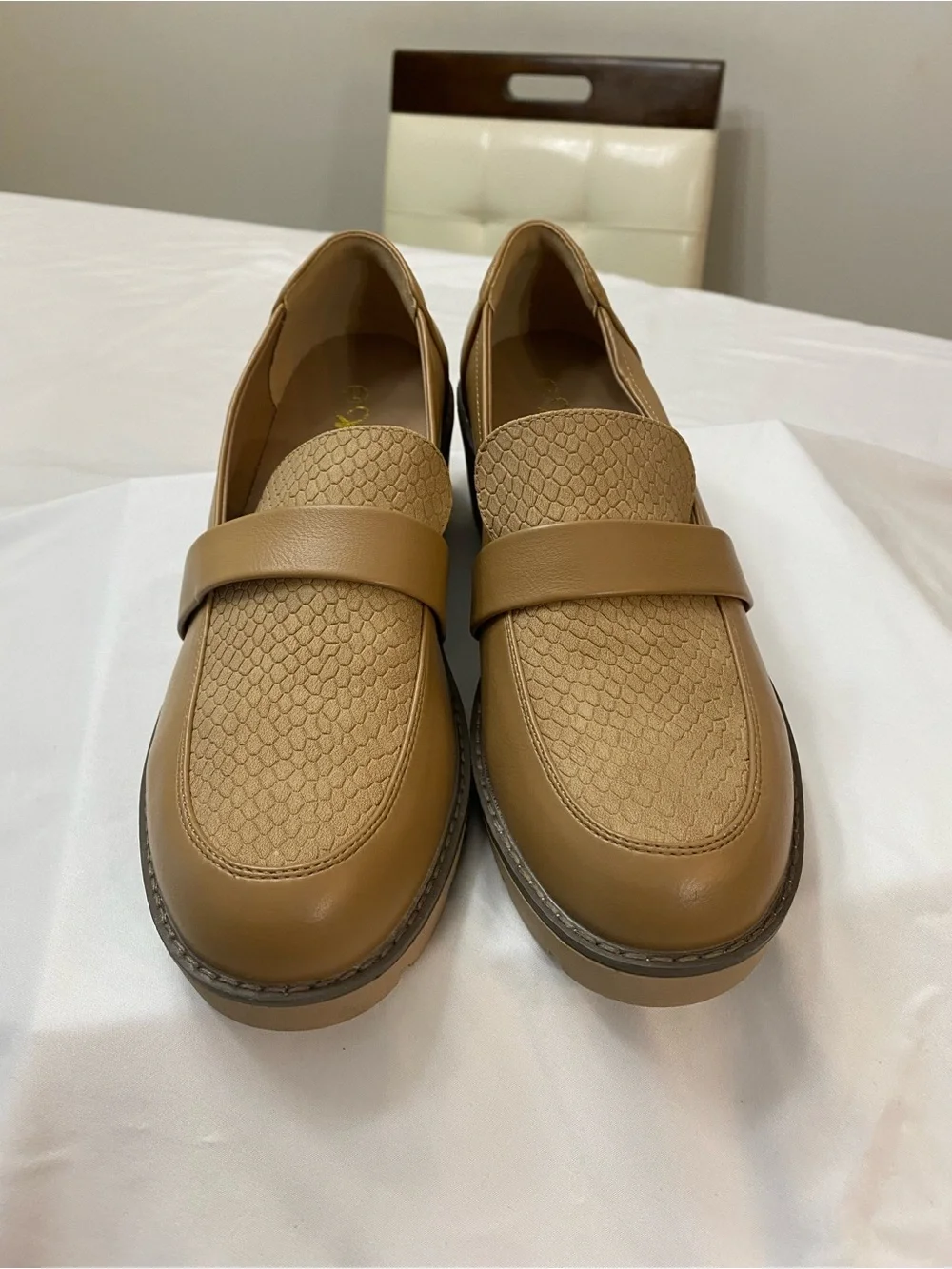 Woman’s Classic Tan Slip-On Loafers with Textured Vamp
